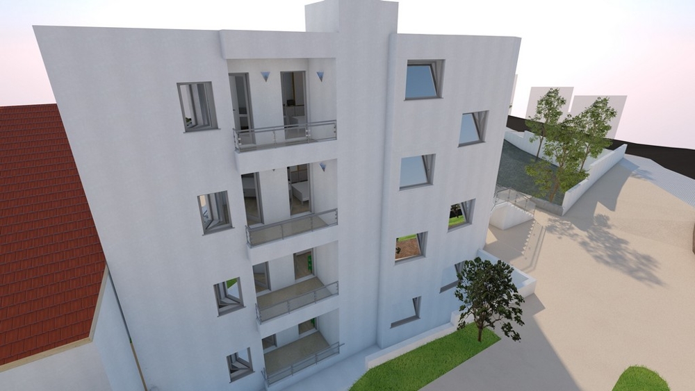 Visualizzazione dell'edificio di lato con alberi davanti