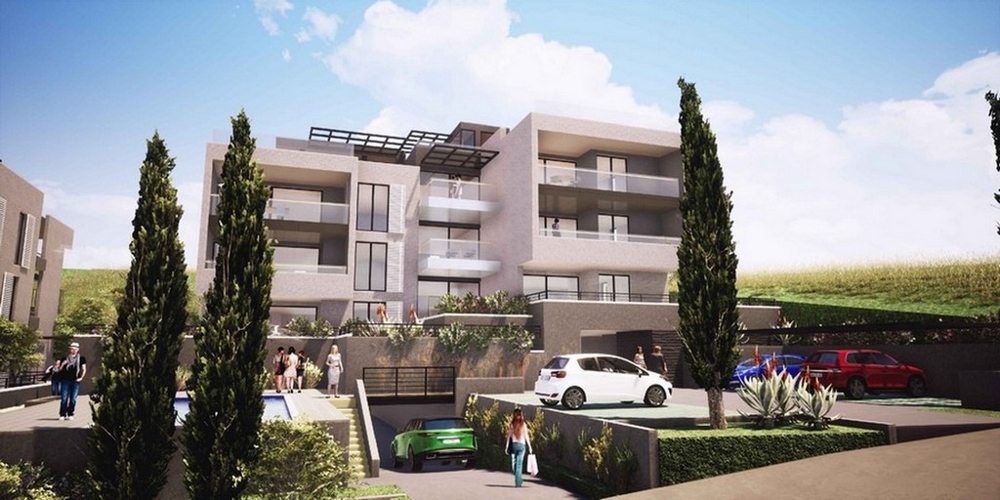 Visualizzazione dell'edificio di appartamenti di nuova costruzione con posti auto