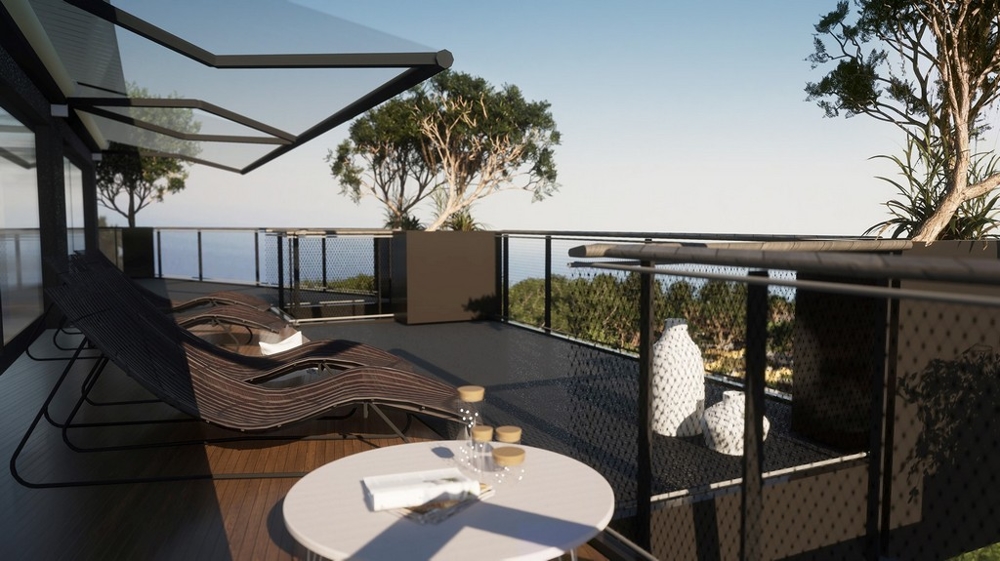 Visualizzazione della terrazza con lettini e tavolo verso il mare