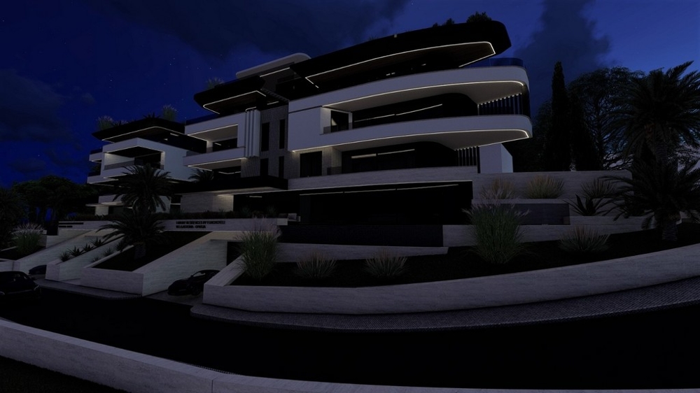 Complesso residenziale moderno di notte con elegante illuminazione architettonica