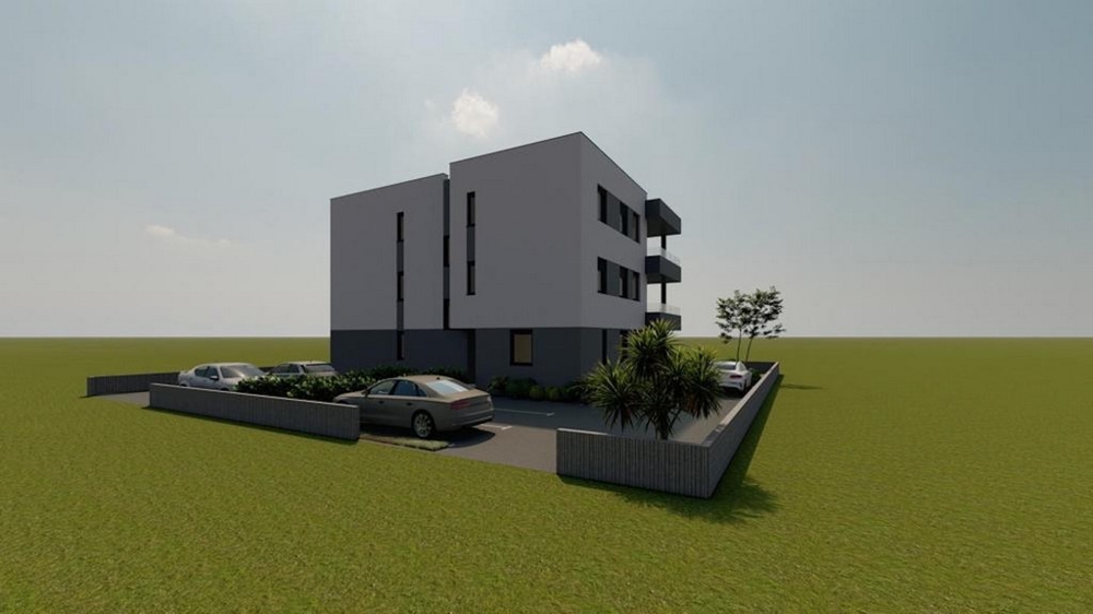Visualizzazione dell'edificio nuovo grigio con posti auto sul prato