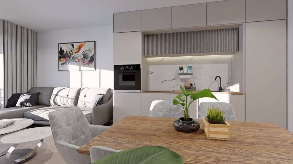 Cucina abitabile aperta con accogliente zona pranzo e dotazioni moderne.