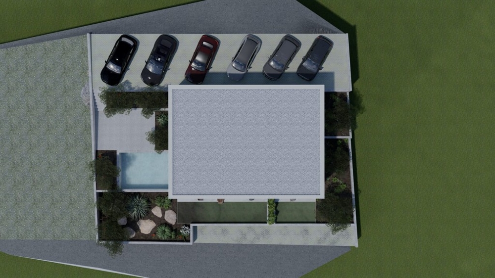Vista dall'alto di un edificio residenziale con posti auto e piscina