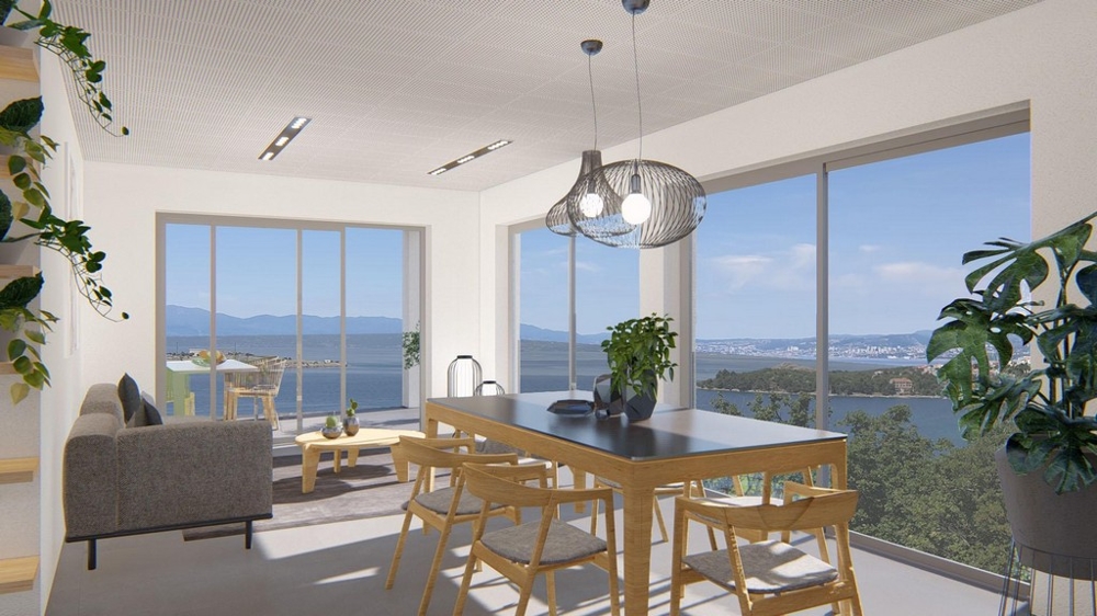 Soggiorno luminoso con zona pranzo e vista panoramica sul mare