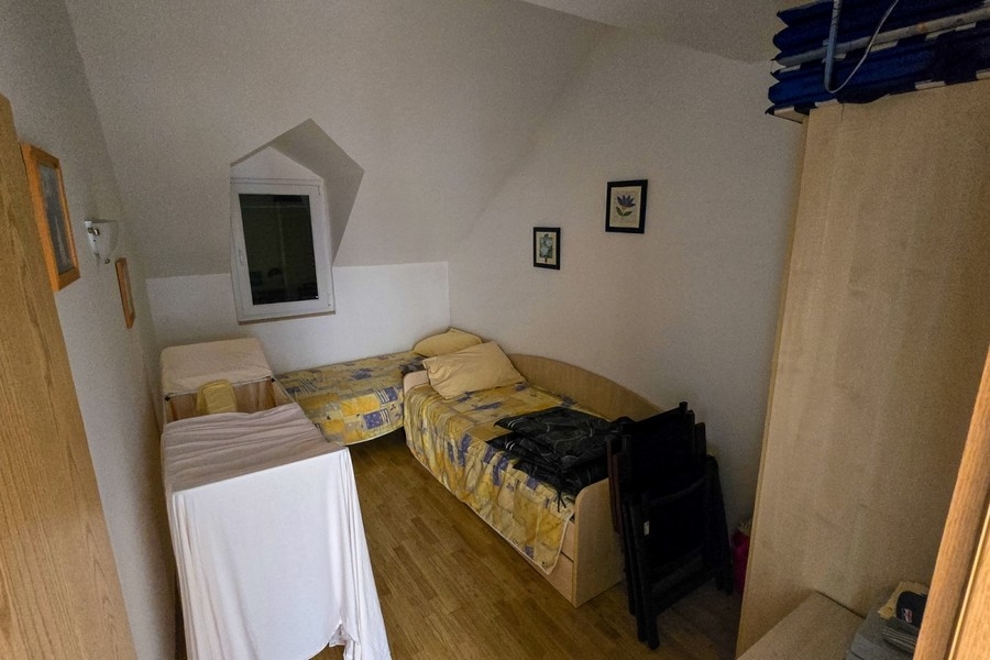 Seconda zona notte con letti singoli sotto il tetto spiovente