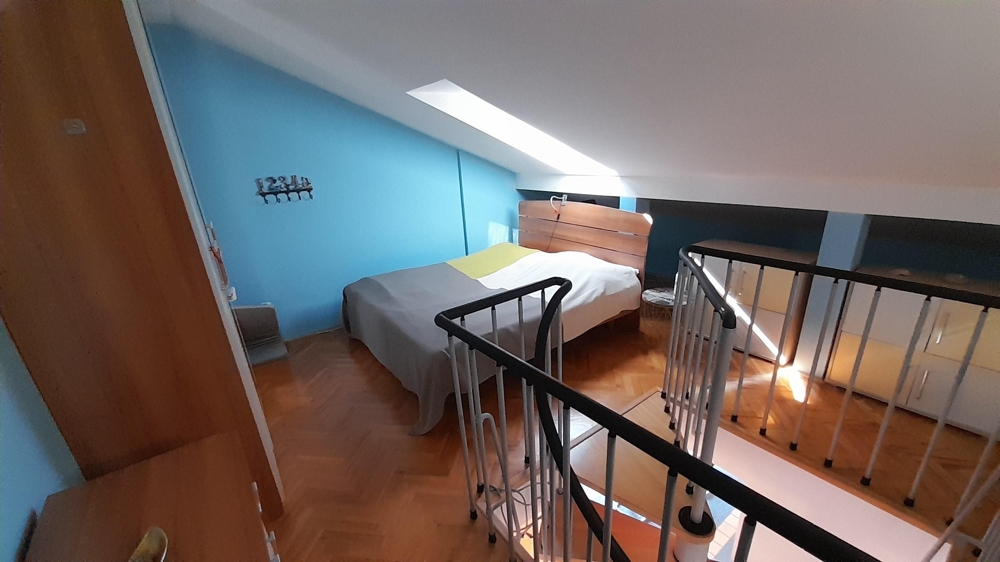 Altra camera da letto nel sottotetto con carattere di galleria