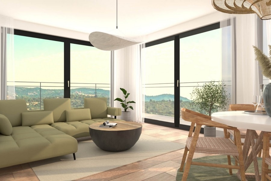 Zona giorno luminosa con grande vetrata e vista mare