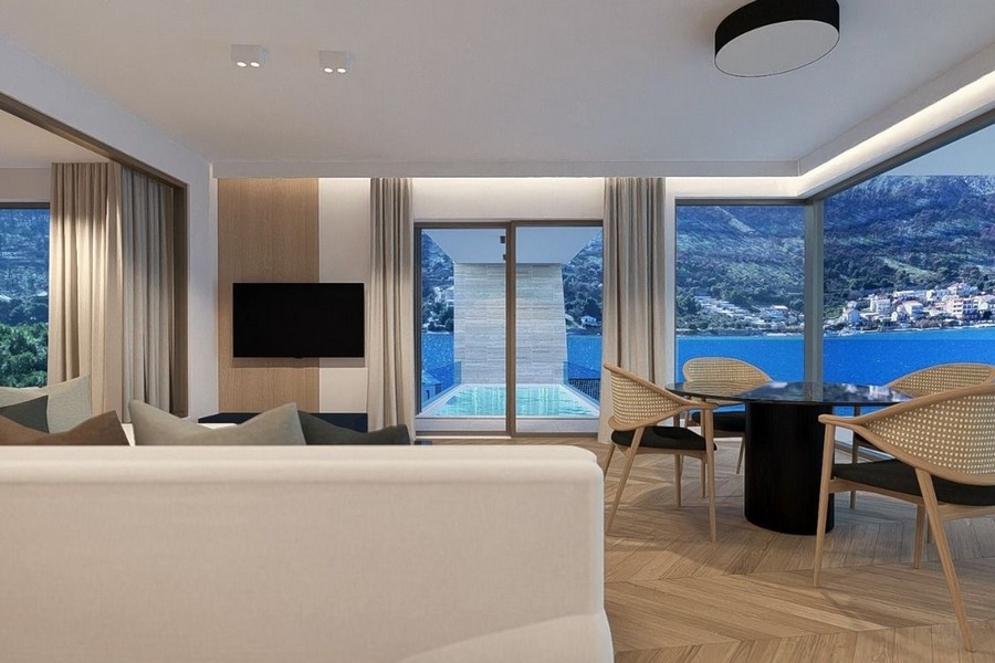 Soggiorno con cucina a vista e vista mare