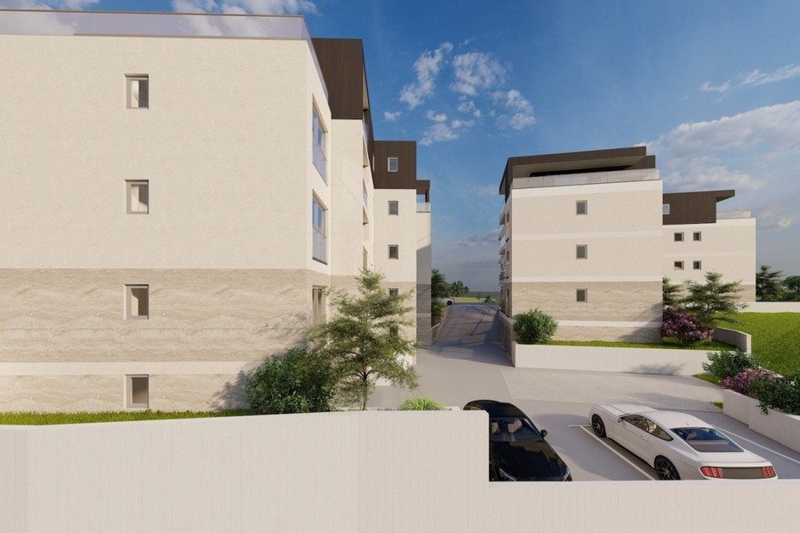 Rendering: vista laterale con cortile e posti auto