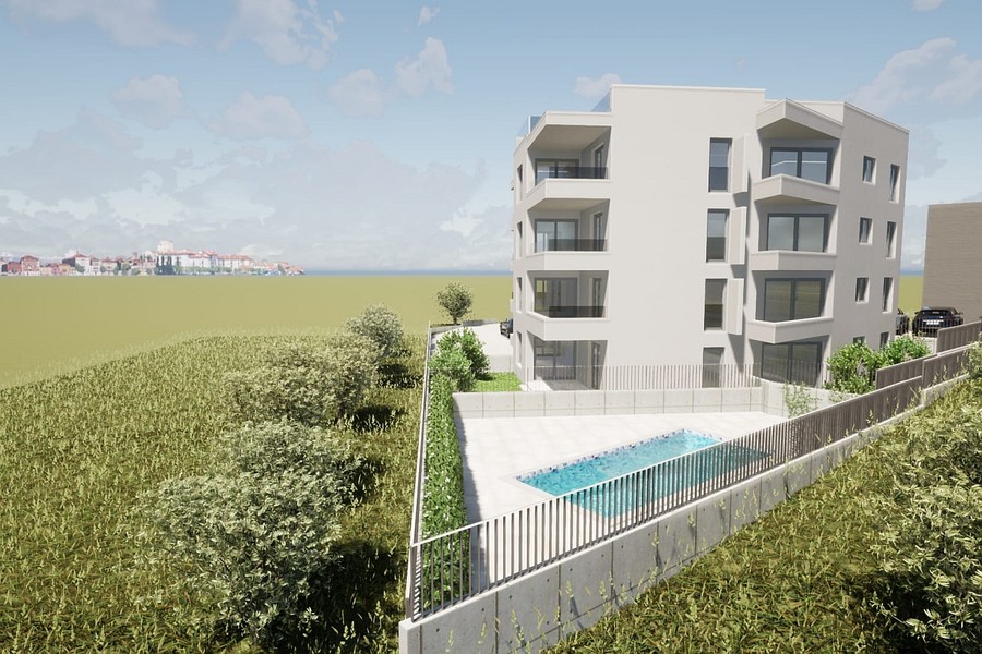 Edificio di nuova costruzione dal lato giardino, con il mare sullo sfondo