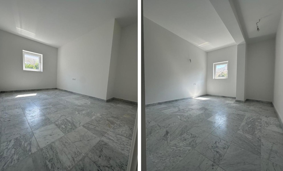 Camera da letto con pavimento in marmo chiaro e finestra