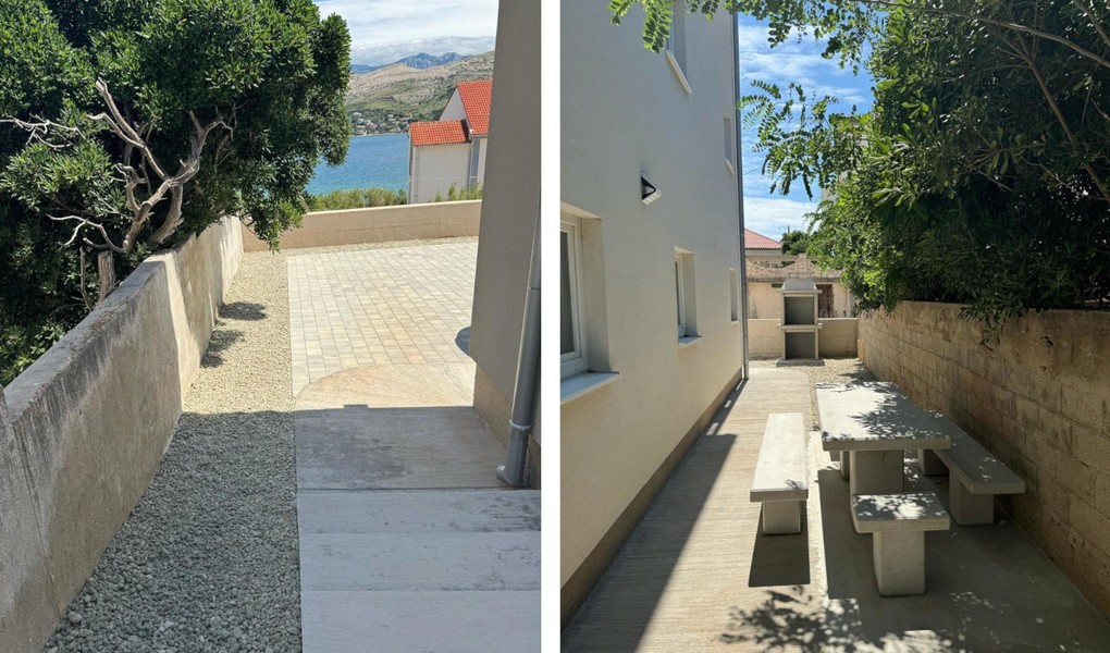 Cortile con vialetto di ghiaia e zona con sedute