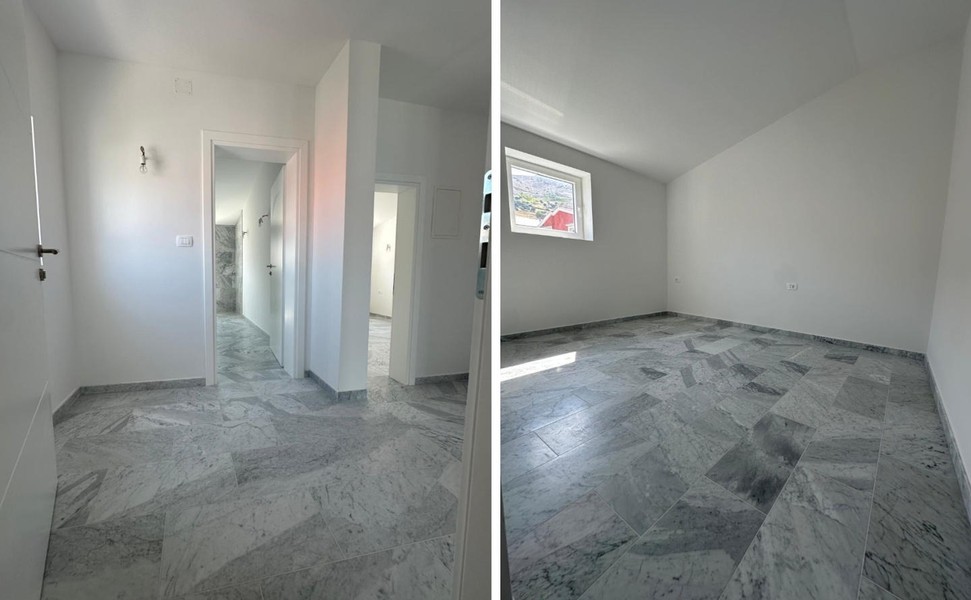 Corridoio e stanza con pavimento in marmo