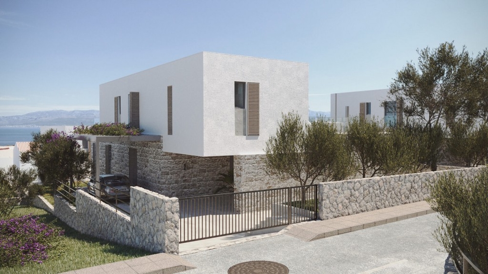 Visualizzazione della casa con zoccolo in pietra naturale dietro il cancello
