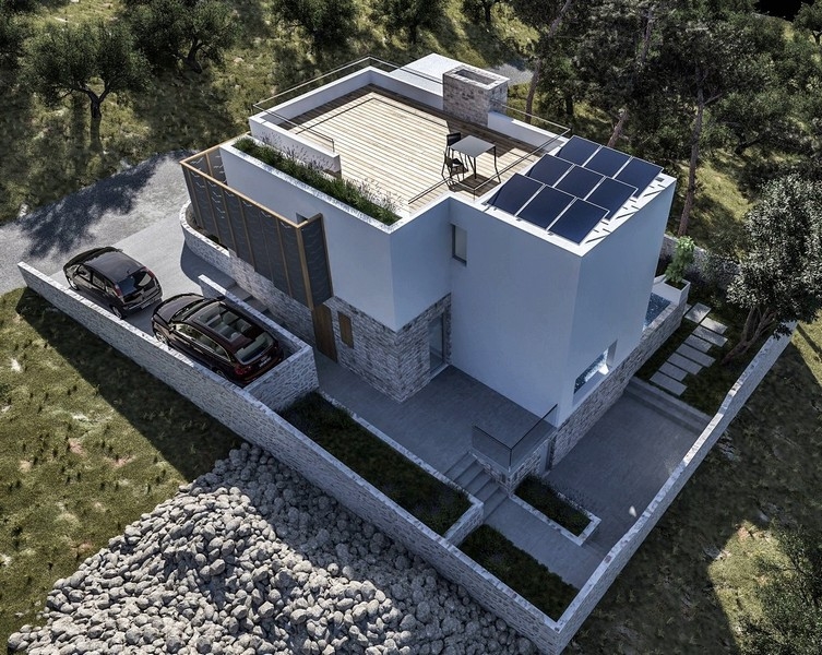 Ripresa con drone di una villa di nuova costruzione con terrazza sul tetto e area esterna, in vendita a Krk, Croazia, circondata da ulivi