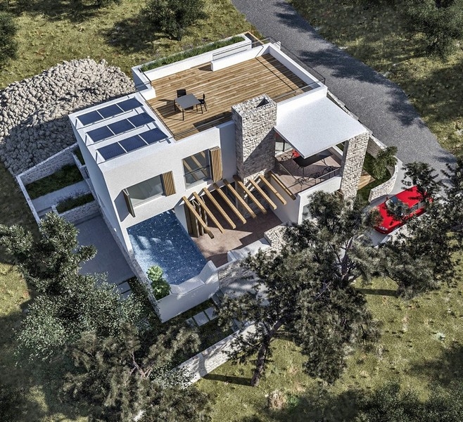 Fase di costruzione di una villa in vendita sull'isola croata di Krk, con pareti di mattoni arancioni e strutture in cemento