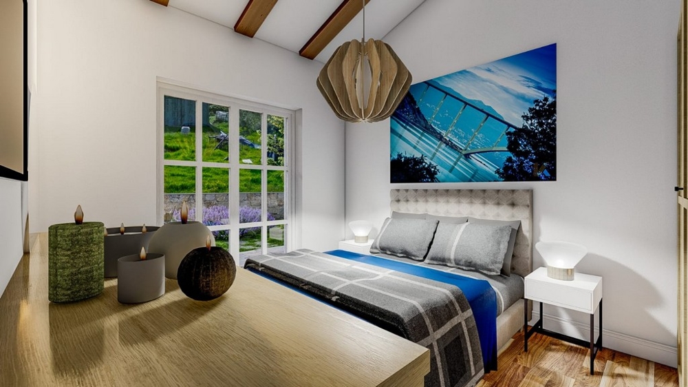 Camera da letto con un grande letto matrimoniale, una coperta a righe blu e grigie, parete bianca, un quadro e vista sul giardino attraverso grandi finestre.