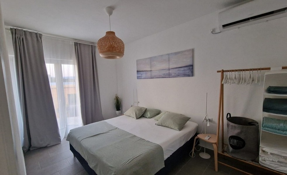 Camera da letto con letto matrimoniale e aria condizionata