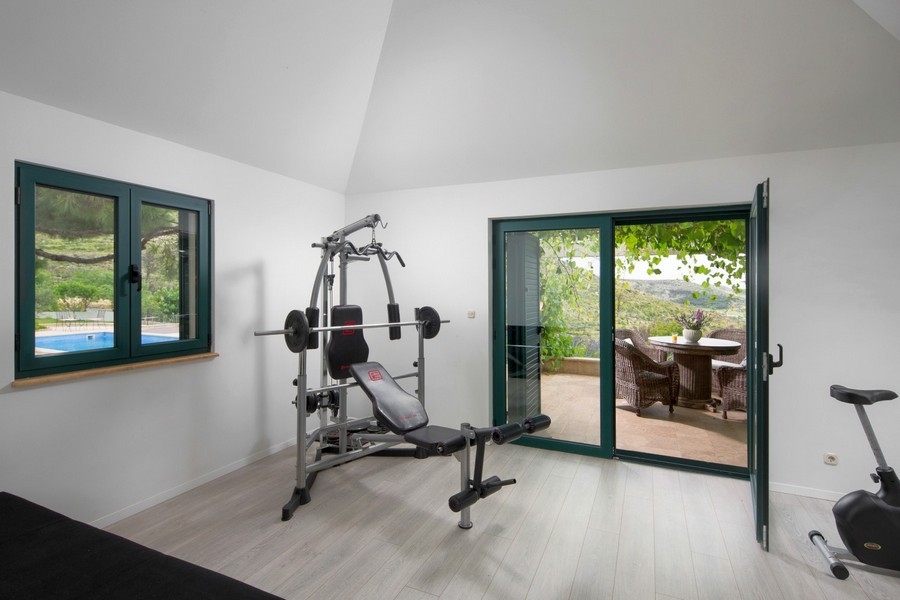 Sala fitness con accesso alla terrazza