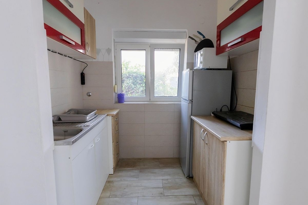 Cucina separata dell'appartamento al piano terra