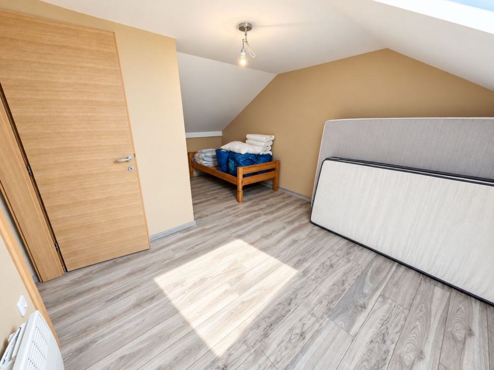 Camera da letto nel sottotetto
