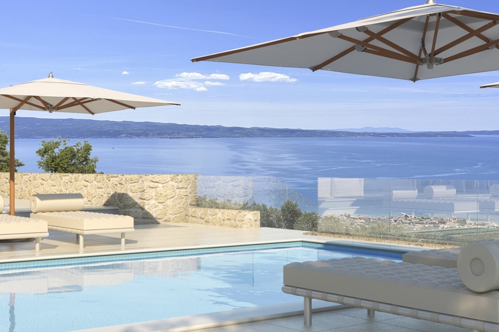 Piscina con zona relax e ampia vista mare