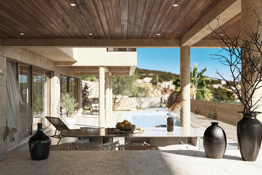 Terrazza coperta con zona lounge accanto alla piscina