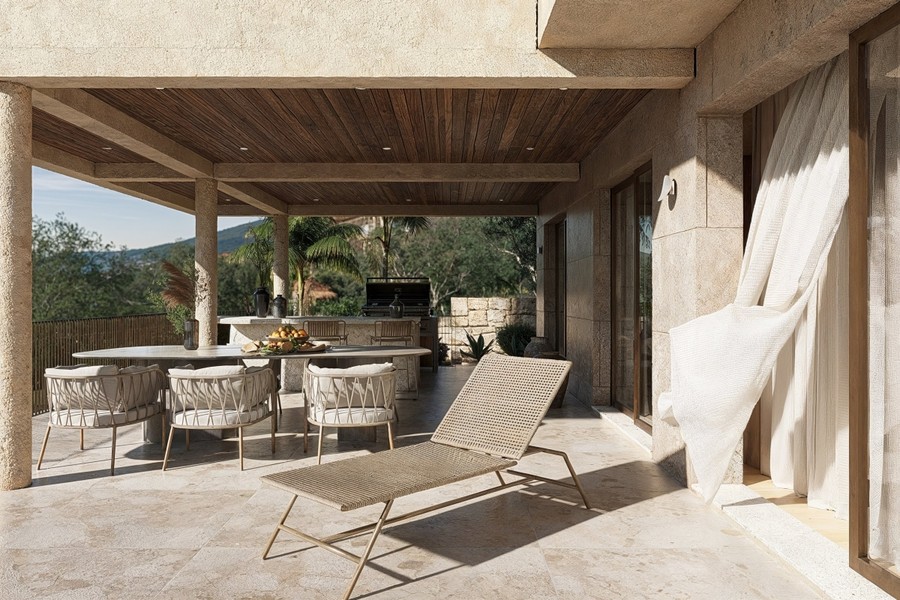 Terrazza con lettino da sole e tavolo da pranzo